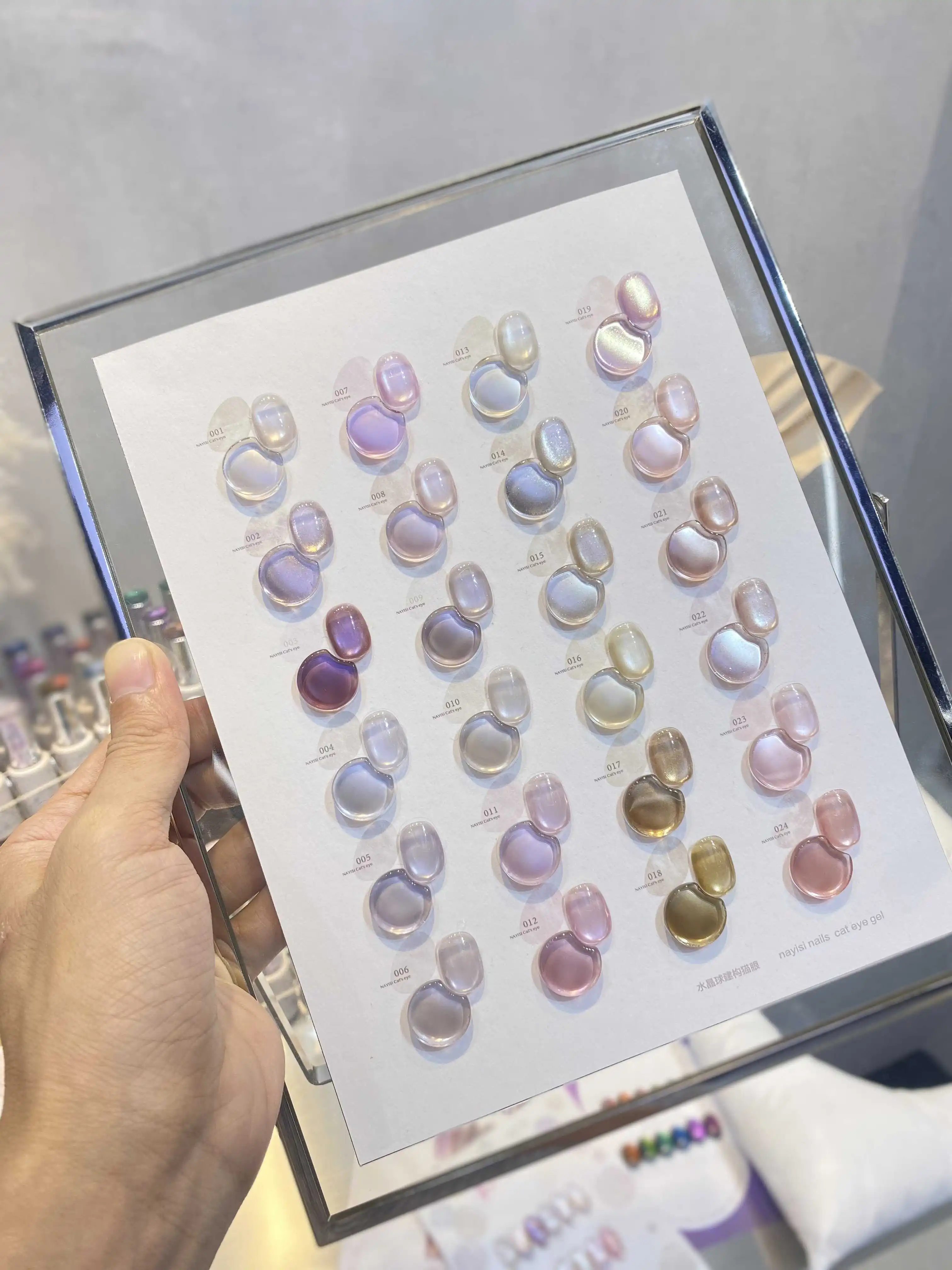 NAYISI 2025 nuevo juego de Gel de uñas de ojo de gato de luz de luna de 24 colores sin HEMA Gel UV no tóxico sin TPO gran oferta botella de producto de exposición de belleza