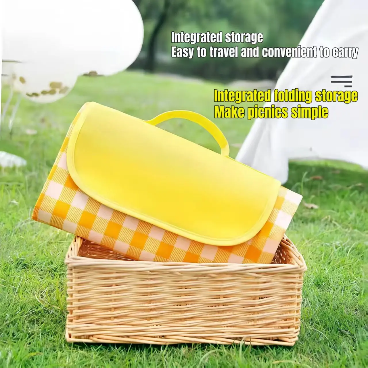 Foldable Waterproof Picnic Mat Folded yellow gingham waterproof picnic mat with carry handle on a wicker basket