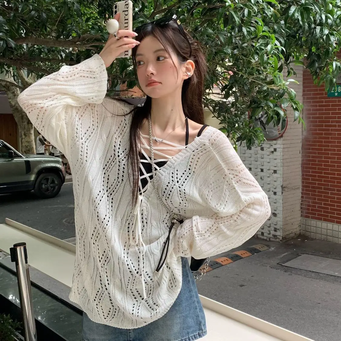 

Women's Spring/summer Loose White Long-sleeved Knitted Sweater with Unique Design and Hollow Strap