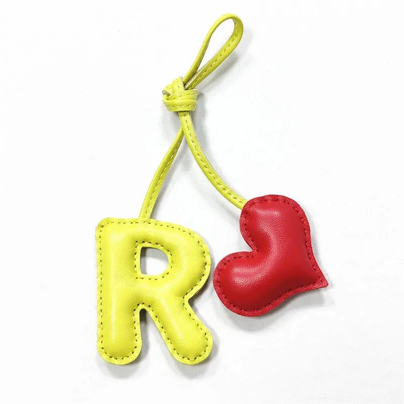 Genuine leather R with heart-shaped letter style bag decoration with pure handmade stitching, high-end car keychain accessories