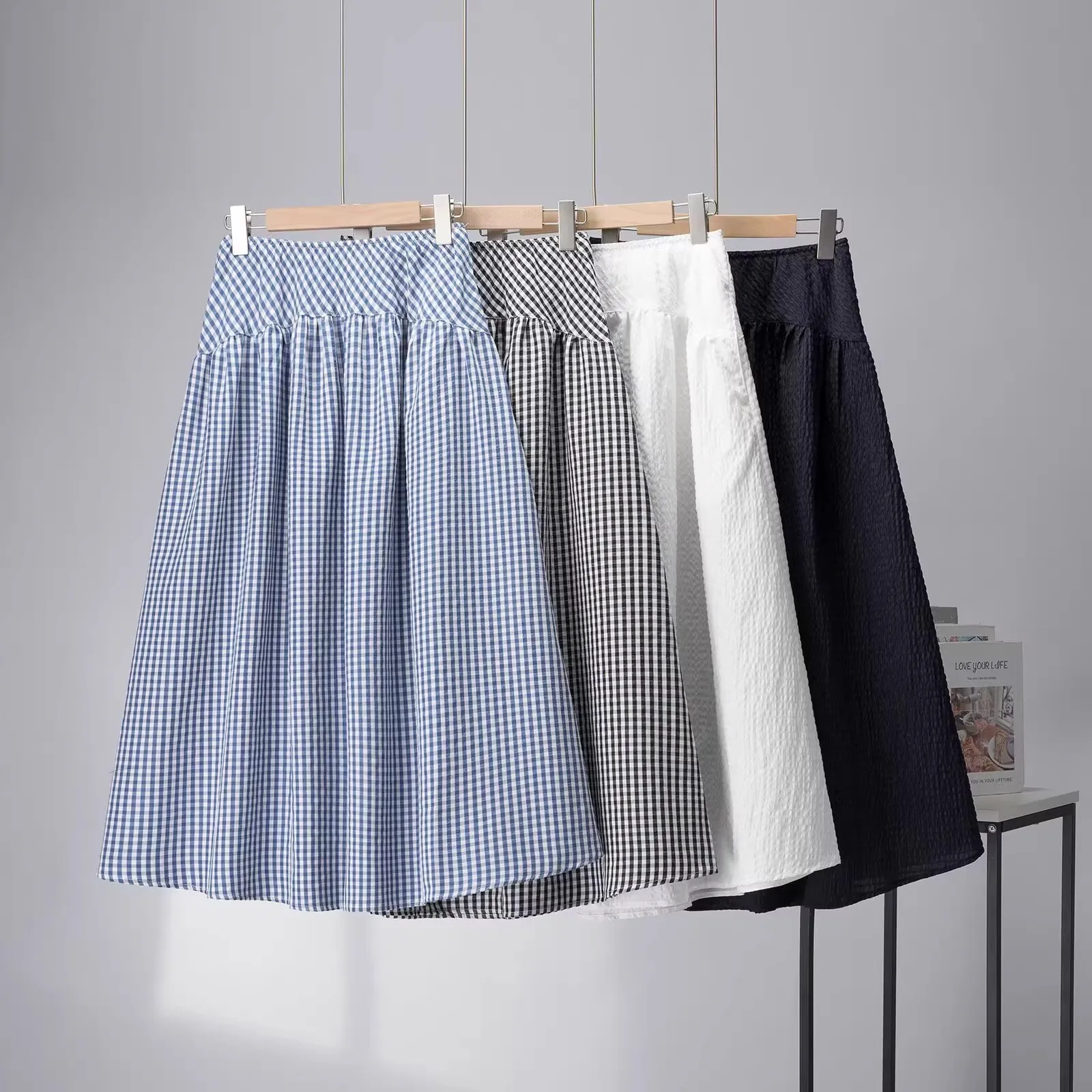 

Удобная ткань с пузырьками, легкая эластичная юбка миди трапециевидной формы с высокой талией, женские весенне-летние юбки f-длины, островные кантри-пе...