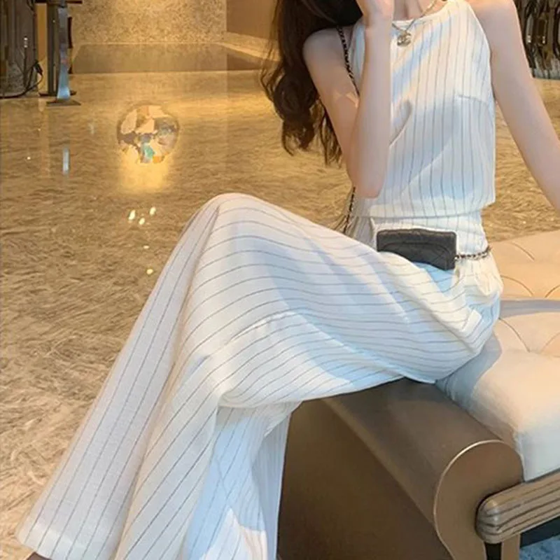 Small fragrance suit female 2024 summer new high sense niche temperament striped vest wide-leg pants two-piece.