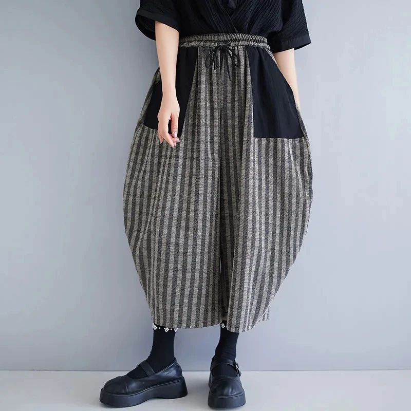women Retro Chinese corduroy striped minority art vase pants bud pants loose light and comfortable stitching casual pants.