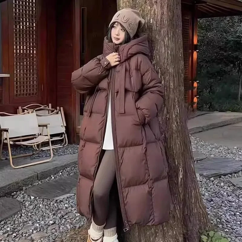 2024 neue Winter Baumwoll jacke Damen Lang mantel koreanische Ausgabe lose dicke Mode Kapuzen jacken weibliche warme Parker Mantel