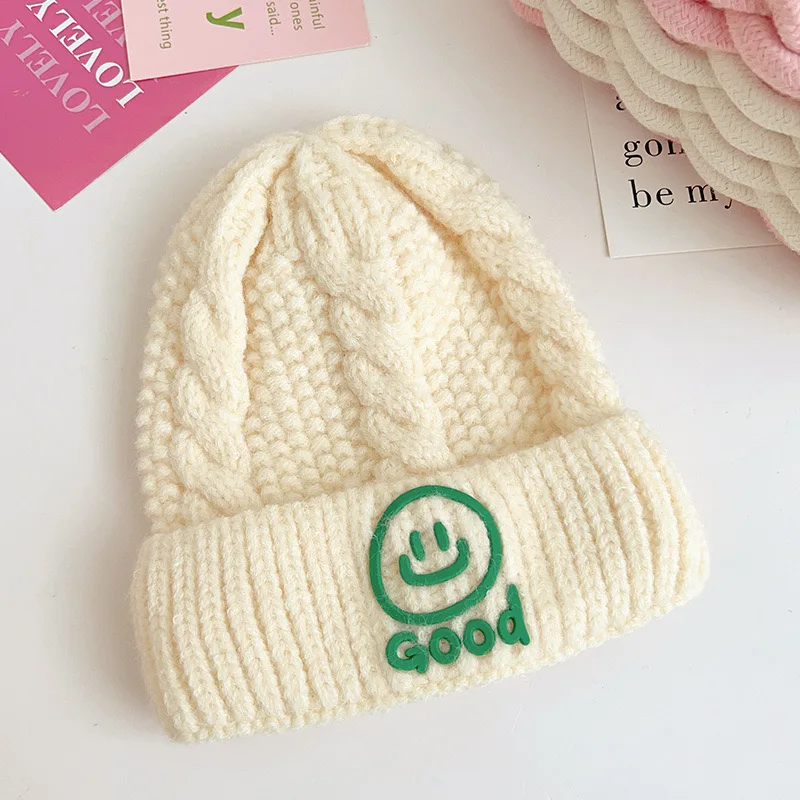 

Children's smiley face knitted hat autumn and winter warm flanged twist 100 casual men's and women's baby knitted hat trend
