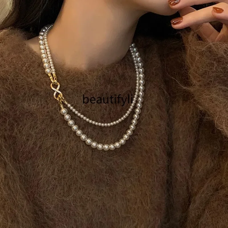 A multi-wearing pearl necklace women's spring and summer sweaterchain high-end sense versatile temperament collarbone neck chain