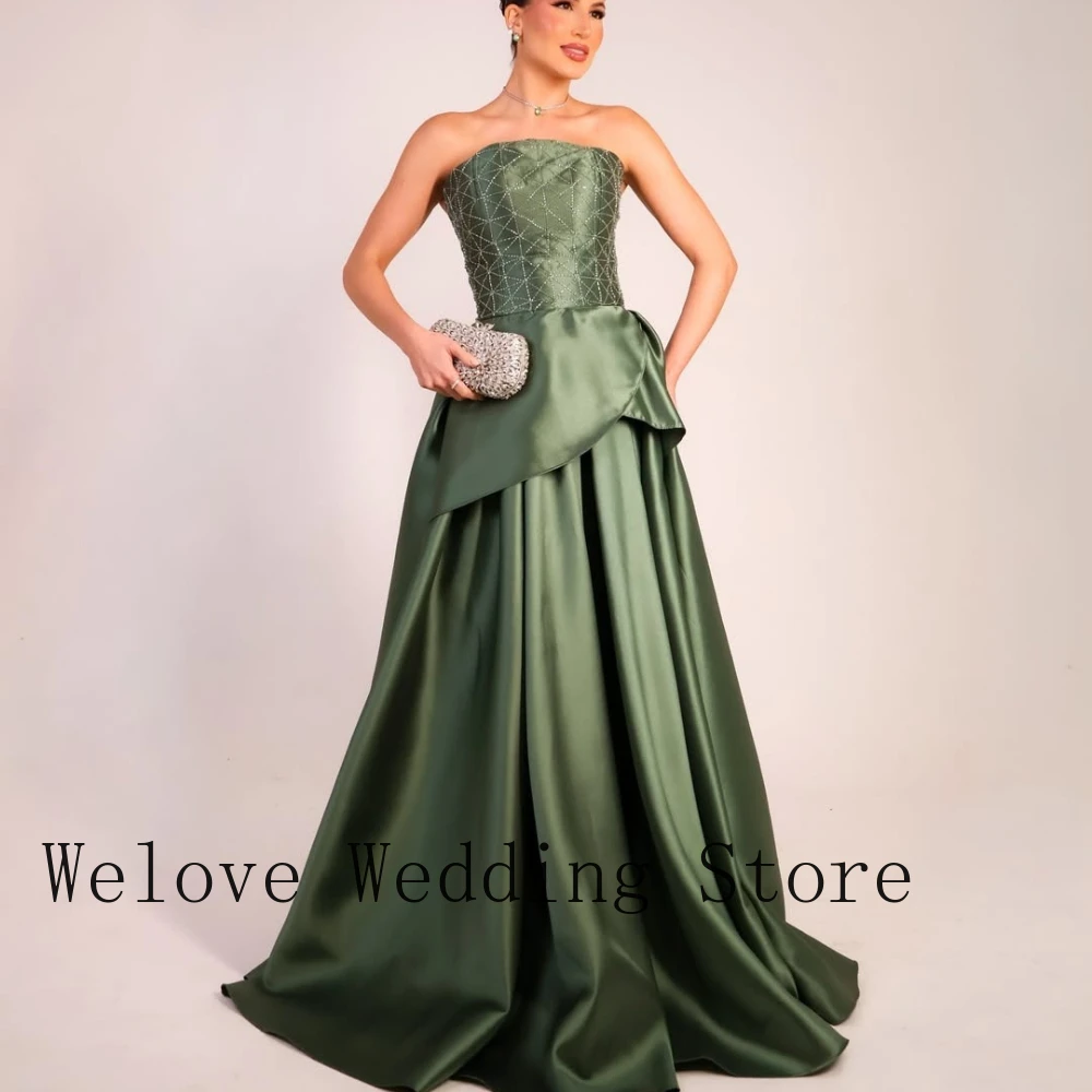 Formal Evening Dress with Strapless Neckline Beaded Embellished Bodice Asymmetric Waist Detail Voluminous Satin Ball Gown Skirt