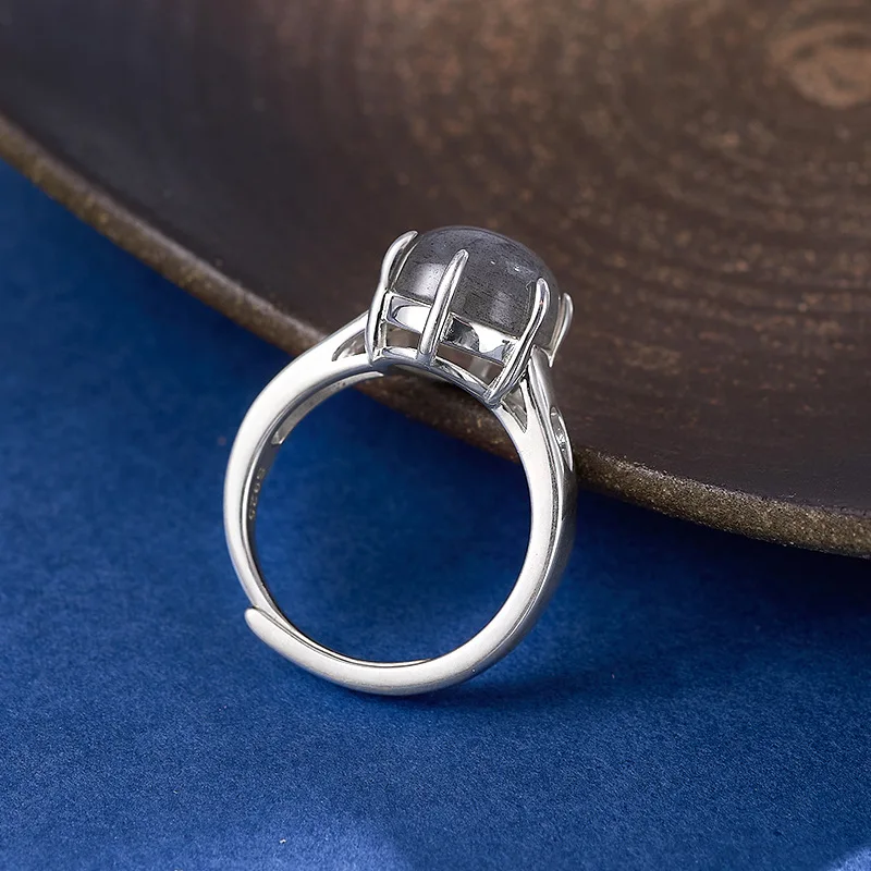 S925 فضة سحر الدائري للنساء الرجال الجوف نمط مخلب مطعمة البيضاوي Moonstone الأزياء والمجوهرات بالجملة