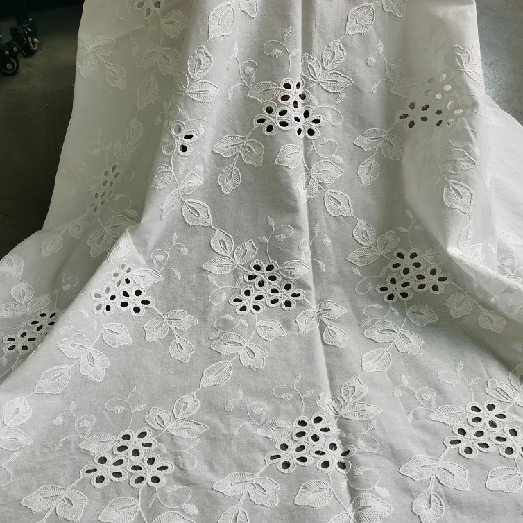 

New white 100% cotton floral embroidered hollow lace fabric for clothing, dresses, wedding dress fabric, DIY sewing