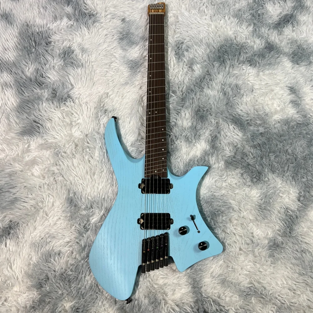 Headless electric guitar; six strings; slanted frets; titanium alloy string locks; bone nut; effective scale length 635mm-48mm