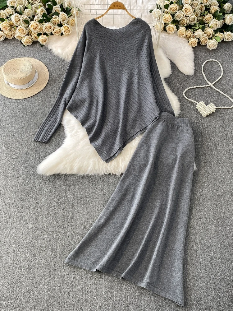 

Осенне-зимний новый модный нишевый вязаный топ нестандартной формы + универсальная утягивающая юбка средней длины с высокой талией, комплект из двух предметов