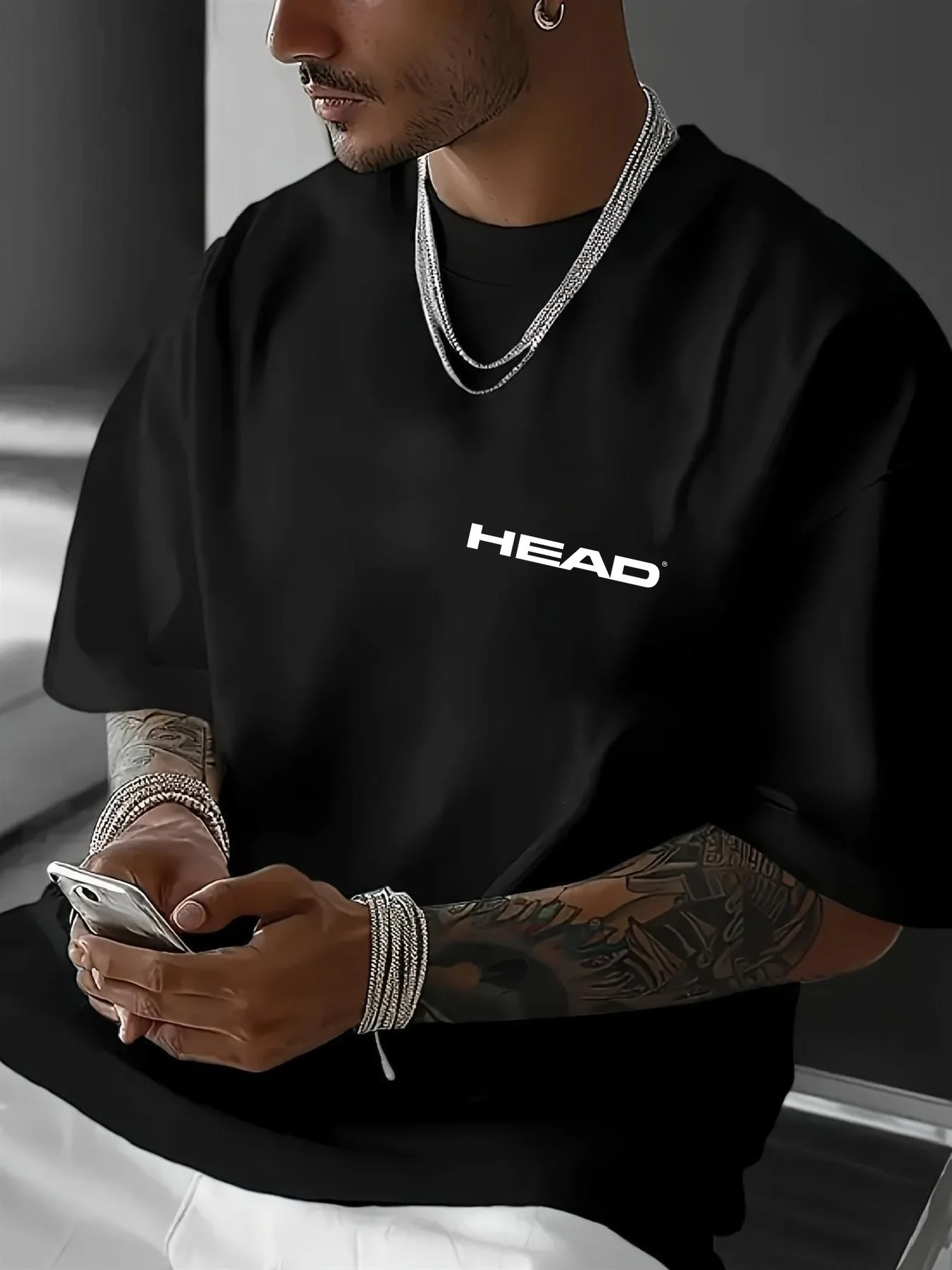 HEAD Men Bright‑White Drop‑Shoulder Short‑Sleeve Apparel Chest Offset Compact Letter Badge Indoor Lounge Urban Street Hang‑out