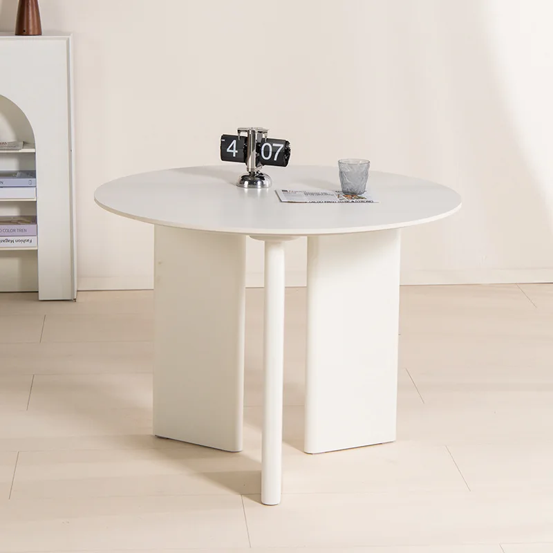 Modern design dining table with sturdy round top and sturdy legs, suitable for home or office use