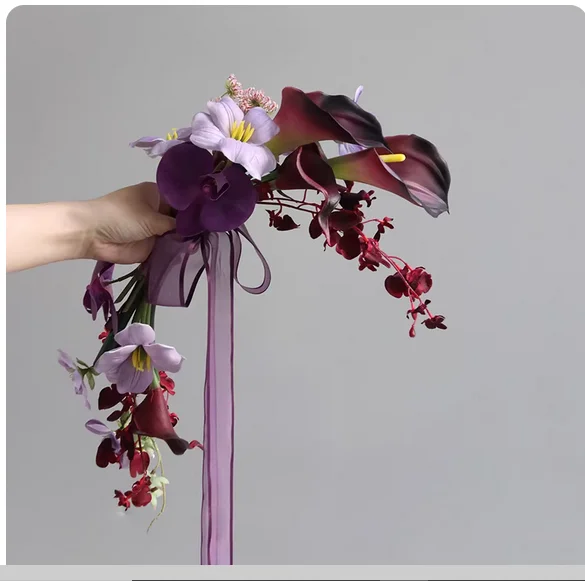 Holding artificial bouquets hand in hand, beautiful tulip bride wedding photography silk flower home decoration purple.  Holding