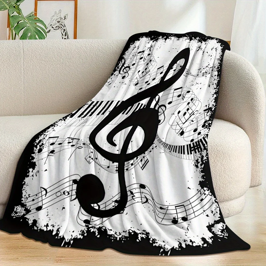 Note and piano key patterned blanket, polyester fabric, machine washable, suitable for bedroom and living room décor.