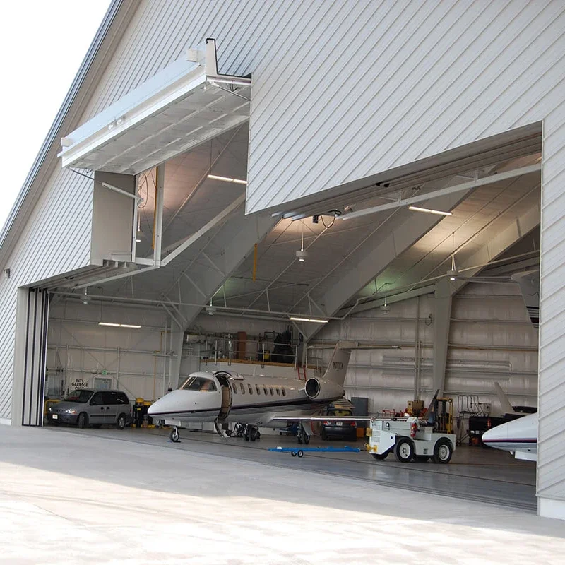 

Simple insulated and durable hangar doors for aircraft access