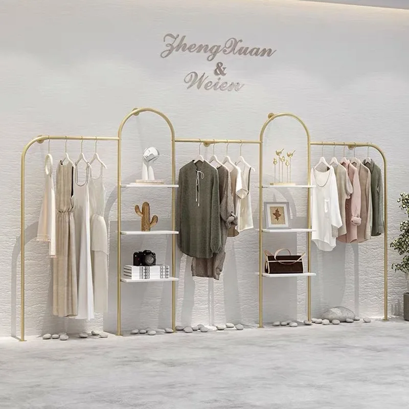 

Women's clothing store shelf display rack creative wall wall hanging hanger gold hanger clothing store wall display rack