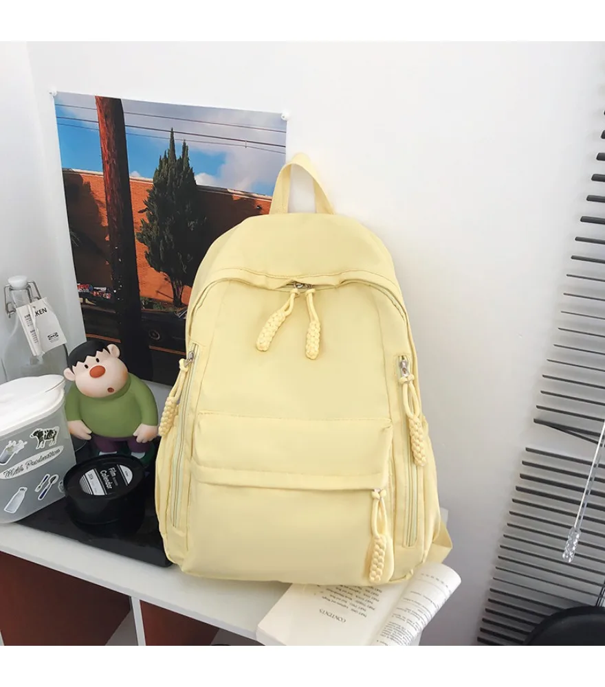 

Cream yellow Japanese style casual backpack side hidden zipper pocket front drawstring pocket braided pull tab lightweight