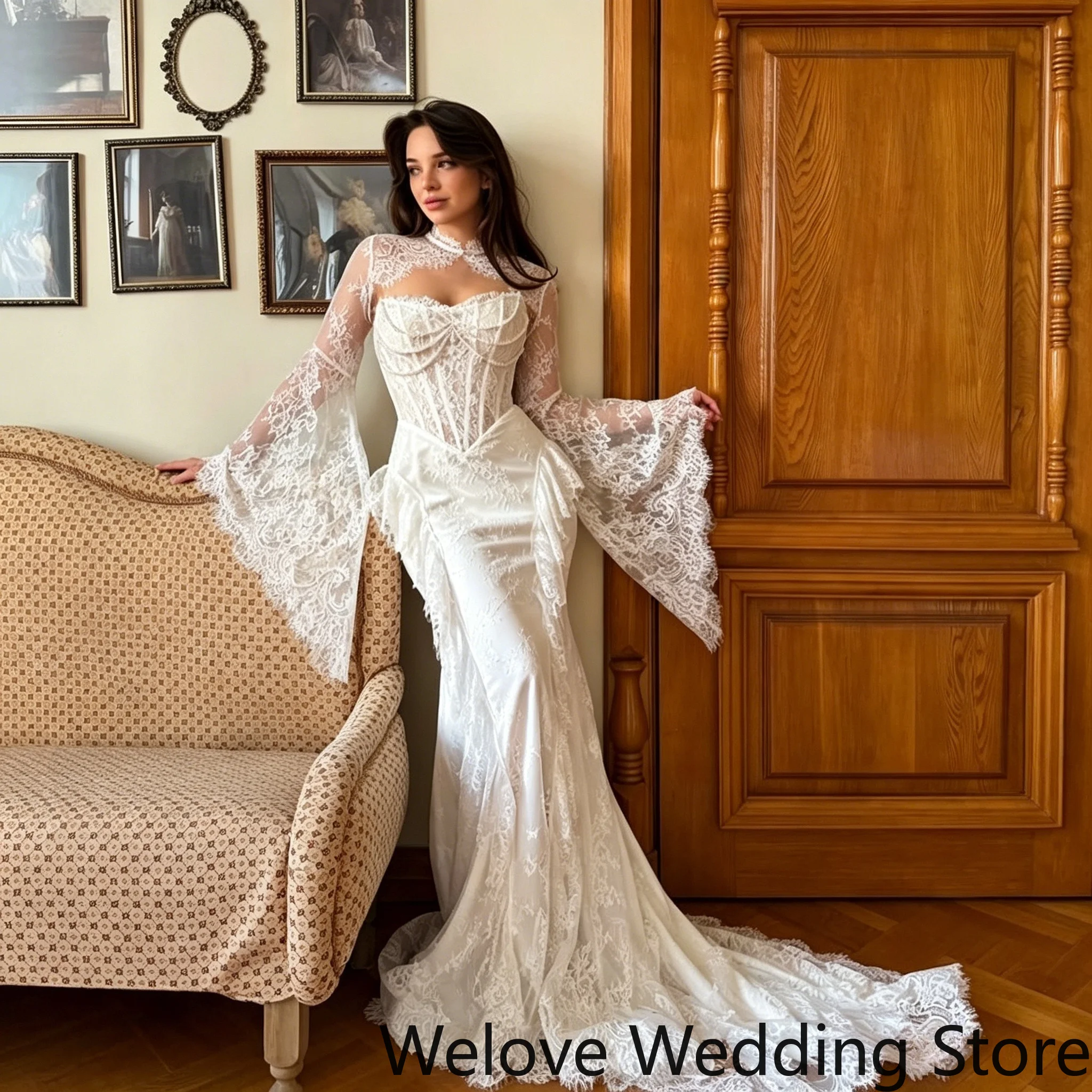 Elegant vintage‑style white mermaid wedding dress with high‑neck sheer lace panel, dramatic oversized flared bell long sleeves