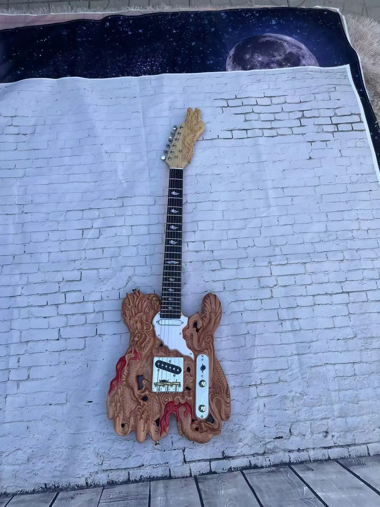 Dragon shaped carved 6-chord electric guitar with a natural wood color body, with real shipping pictures and stock available