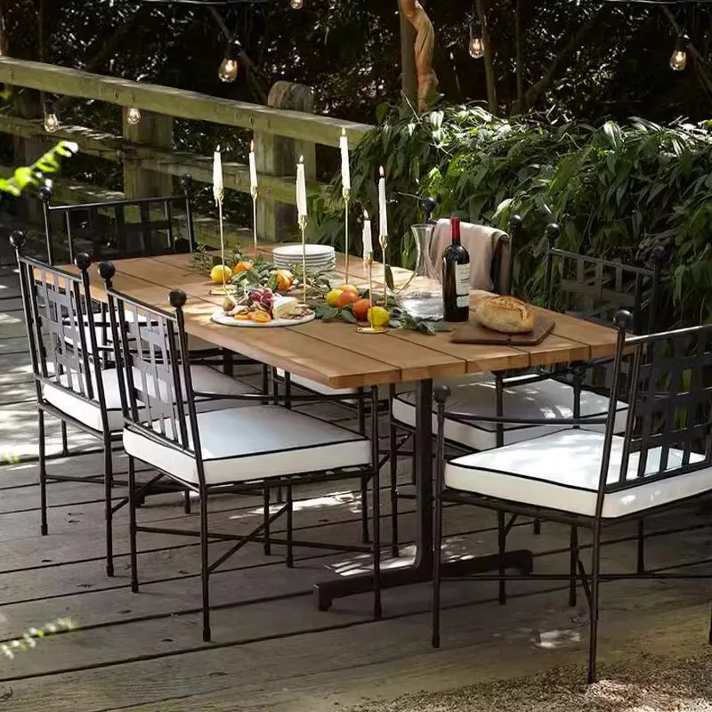 

Уличная кованая мебель для двора: комплект из плетеного кресла и обеденного стола для террасы, водонепроницаемый и защищающий от солнца.