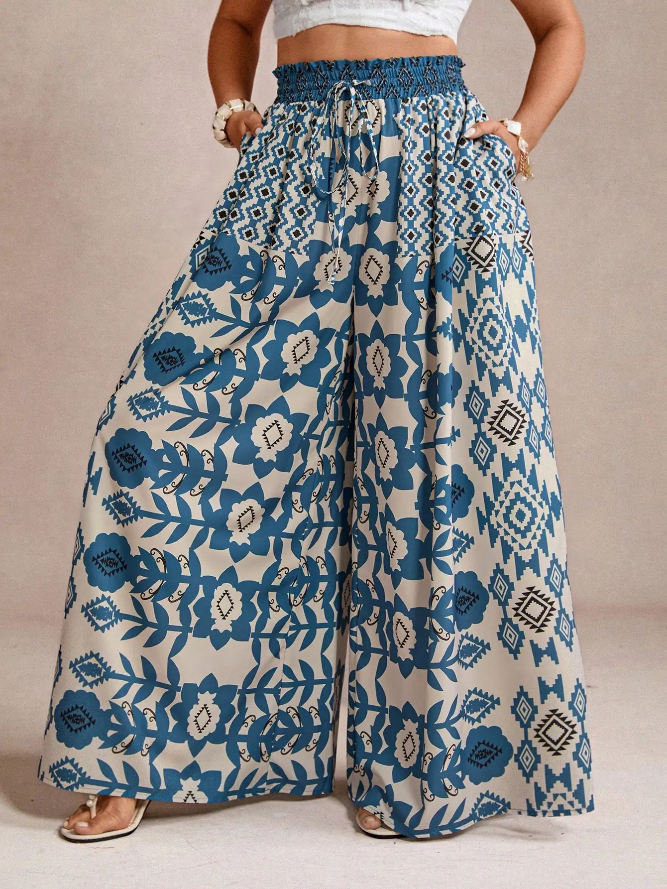 

Женские свободные брюки больших размеров синего цвета с цветочным принтом и завязками на талии для повседневной носки