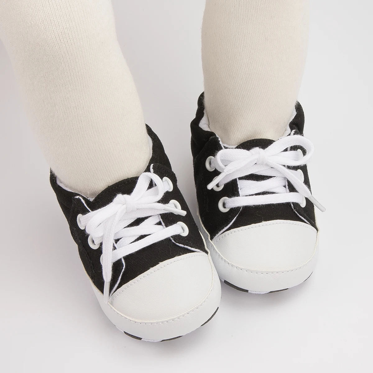 الربيع والخريف الوليد الطفل الأسود حذاء كاجوال بولي Leather الجلود Bowknot T-حزام الحد الأدنى الأولى مشوا لينة القطن المضادة للانزلاق وحيد