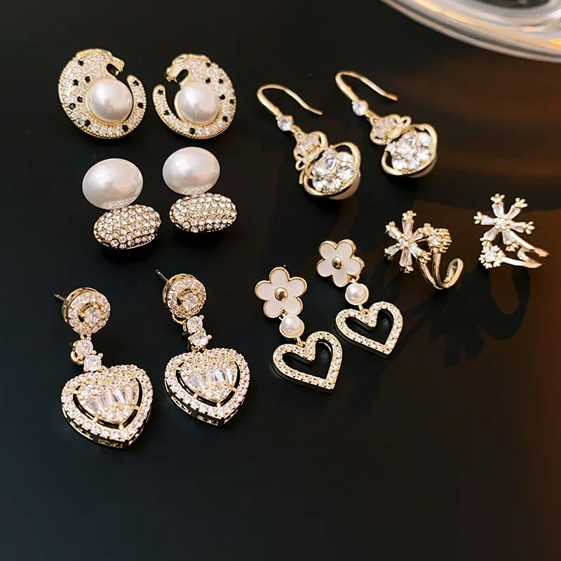 

Silver needle flower hollowed-out heart-shaped zircon earrings Fashionable and simple drop earrings suitable for women