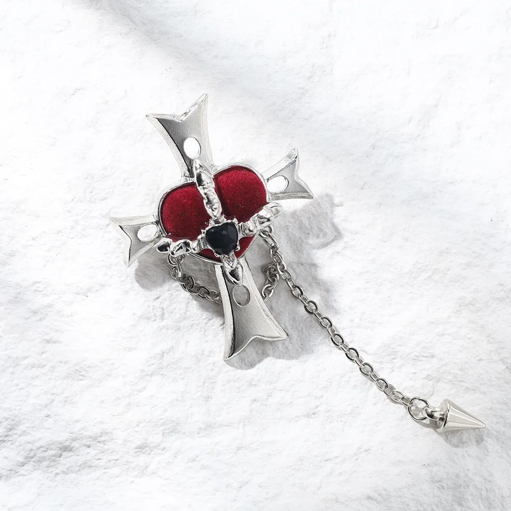 

A velvet heart-shaped brooch with a peach heart cross, elegant retro style