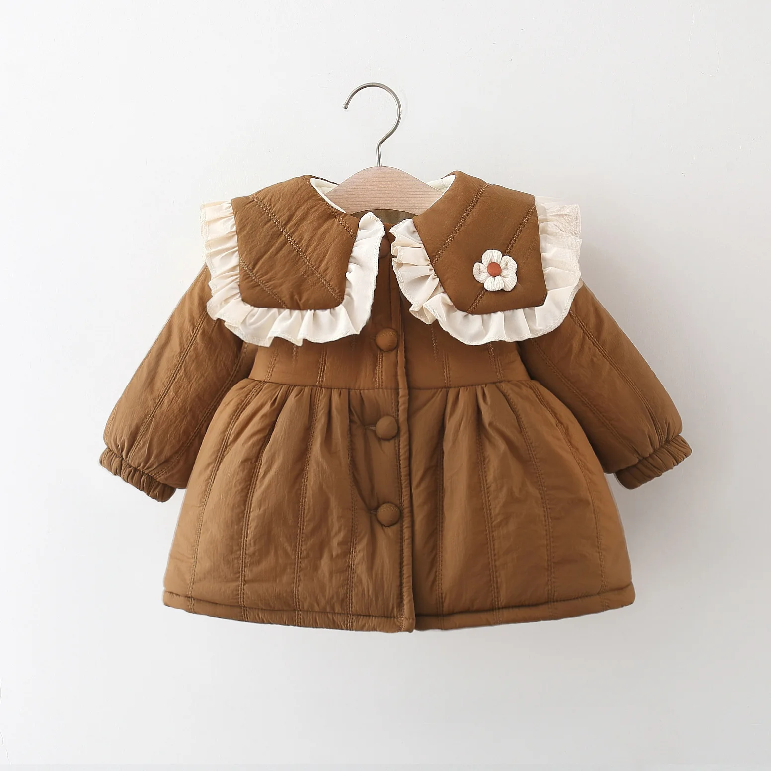 New winter clothing with a collar featuring a flower and quilted cotton thread. Girls' clothing with thick velvet and fashionabl