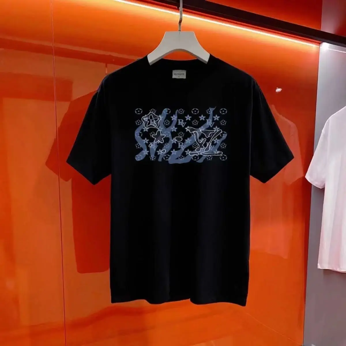 2025 masculino e feminino solto nova camiseta tendência tripulação pescoço casual marca de moda verão algodão de manga curta impresso topo tudo