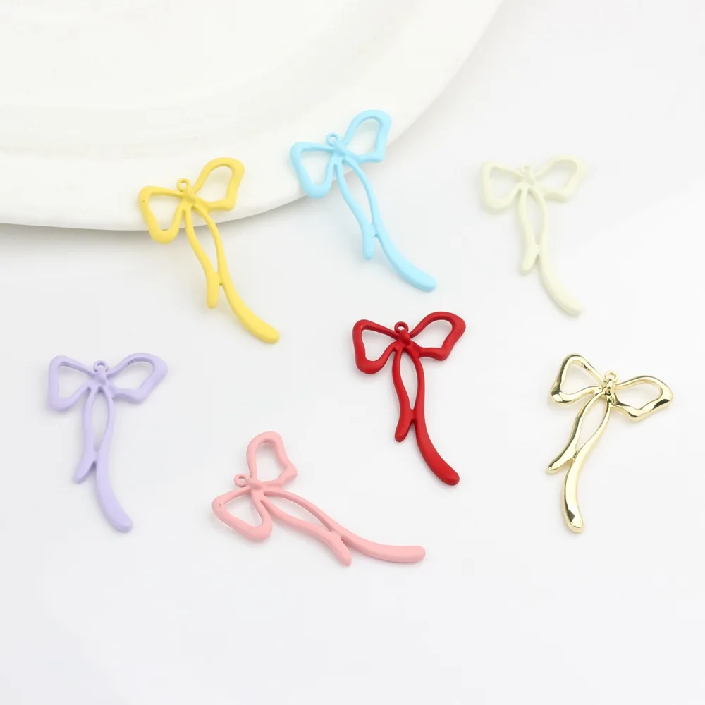 

Newest 50pcs 45*26mm Rubber Enamel Alloy Ribbon Knot Tie Bow Charms Fit Earring Necklace Bracelet Ornament Accessories Pendants