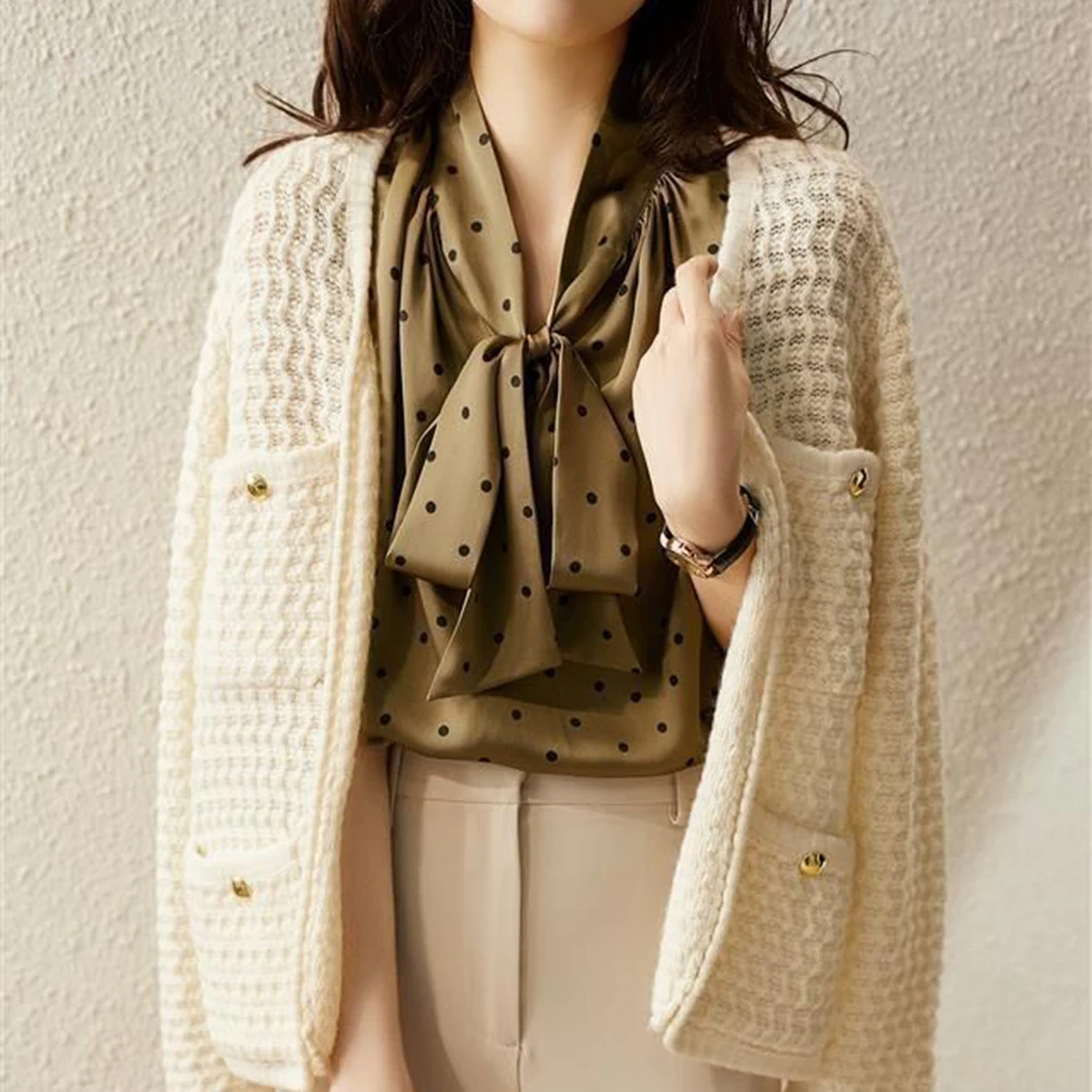 

Sleek Ladies Button Up Top designed from smooth satin fabric featuring playful polka dots to brighten up any day