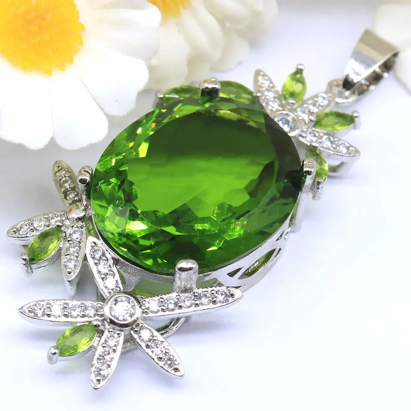 

Серебряный кулон SheCrown 53x25 мм с фиолетовым танзанитом, зеленым перидотом, родолитом, гранатом, кунцитом и фианитами для свадьбы