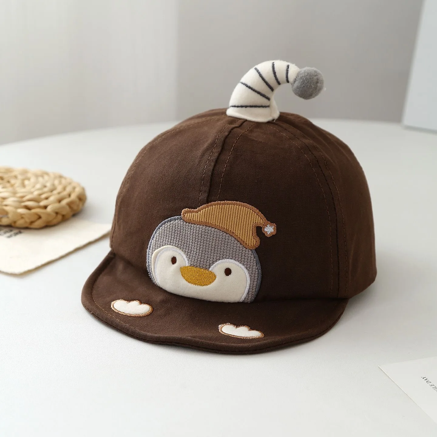 Children's embroidered little penguin with curved beak and fluffy balls on the hat, decorative soft brimmed baseball cap
