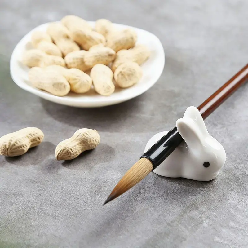 Creative ceramic rabbit shaped brush rest cute ornament for study room paperweight writing brush holder small decor piece