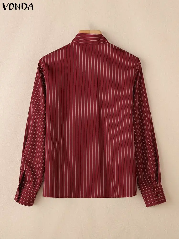 Elegancka bluzka damska VONDA do biura, dekolt w serek, koszule w paski, moda 2025, długi rękaw, luźny krój, nadruk, bluzki damskie do pracy.