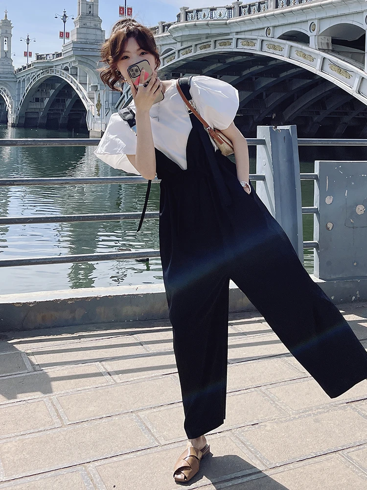 طقم جمبسوت نسائي عالي الخصر وواسع الساق مكون من قطعتين لصيف 2025 تي شيرت كوري جديد فضفاض مع لوتس لو سويس