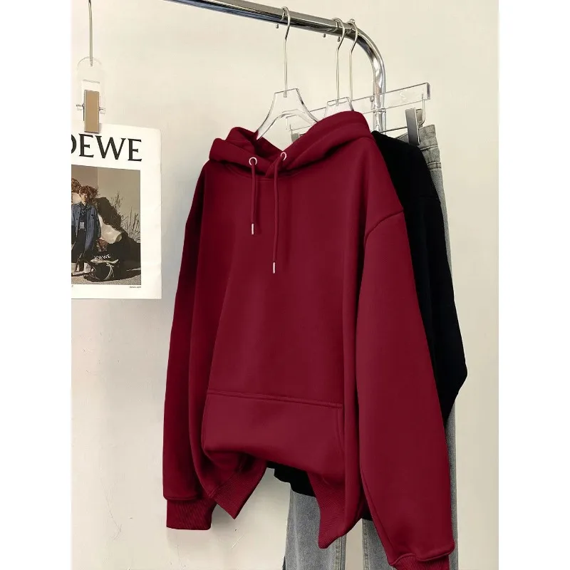 ファッショナブルなルーズソリッドカラー長袖スウェットシャツ女性用秋と冬ベルベット厚みのあるデザインフード付きトップ