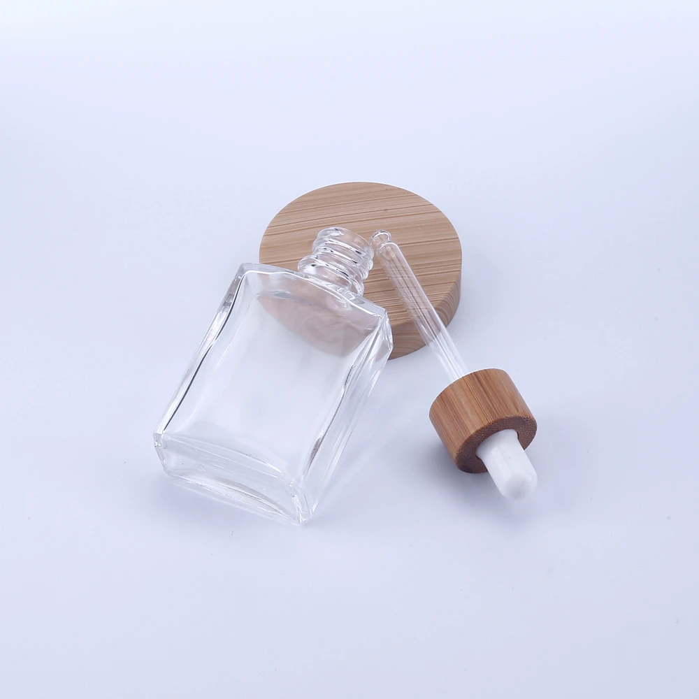 200 SZTUK 30 ml 50 ml 100 ml Szklana butelka z zakraplaczem z bambusową pokrywką Puste opakowanie kosmetyczne Pojemniki Fiolki Butelki olejków eterycznych