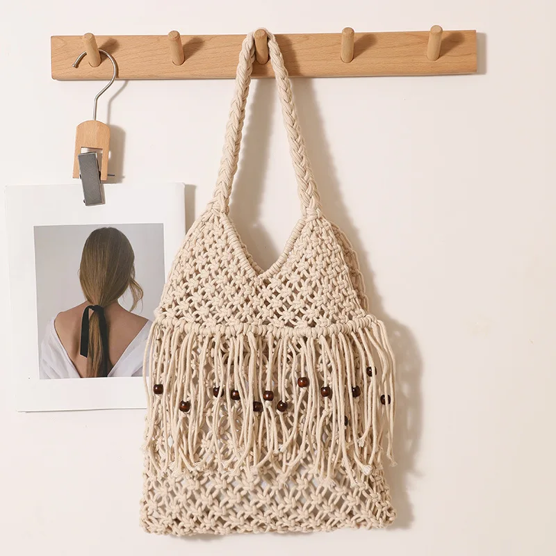 

Bohemian Rope Knitting Beach Bag Hollow Tassel Shoulder Bag NEW Handmade Crochet Woven Bags for Women Wooden Beads Handbag Tote