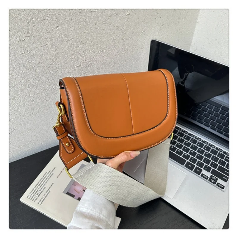 

Light casual saddle crossbody with thick woven wide strap & refined metal fittings, portable build for outdoor casual outings