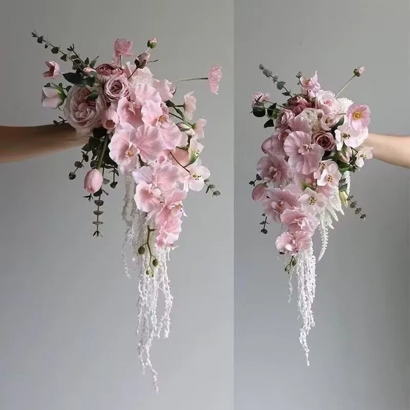 Bride wedding photography, pink butterfly orchid, silk flowers, home living room countertop dining table placement