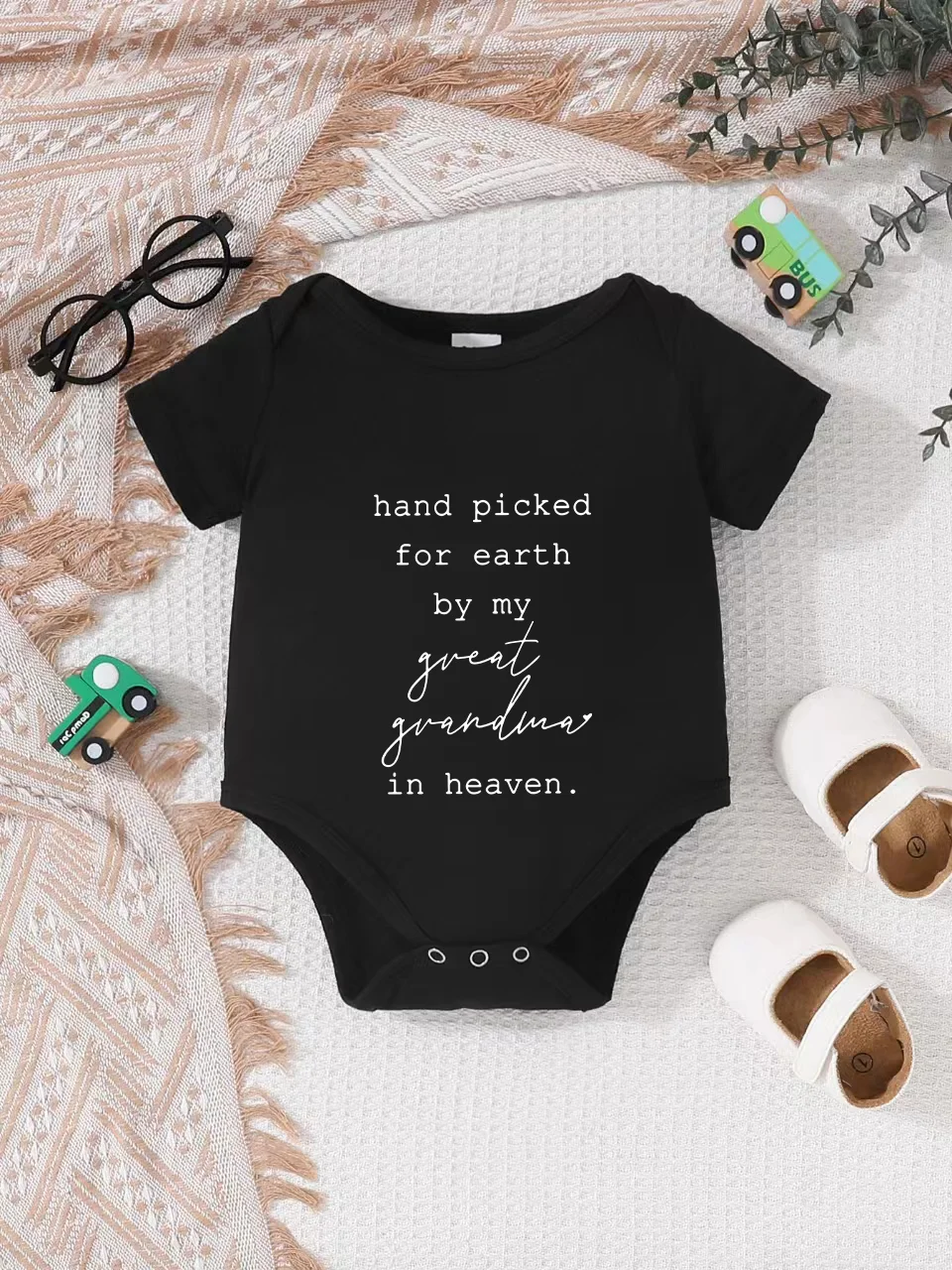 Playful letter-printed baby short-sleeve triangle bodysuit. Button closure for easy dressing