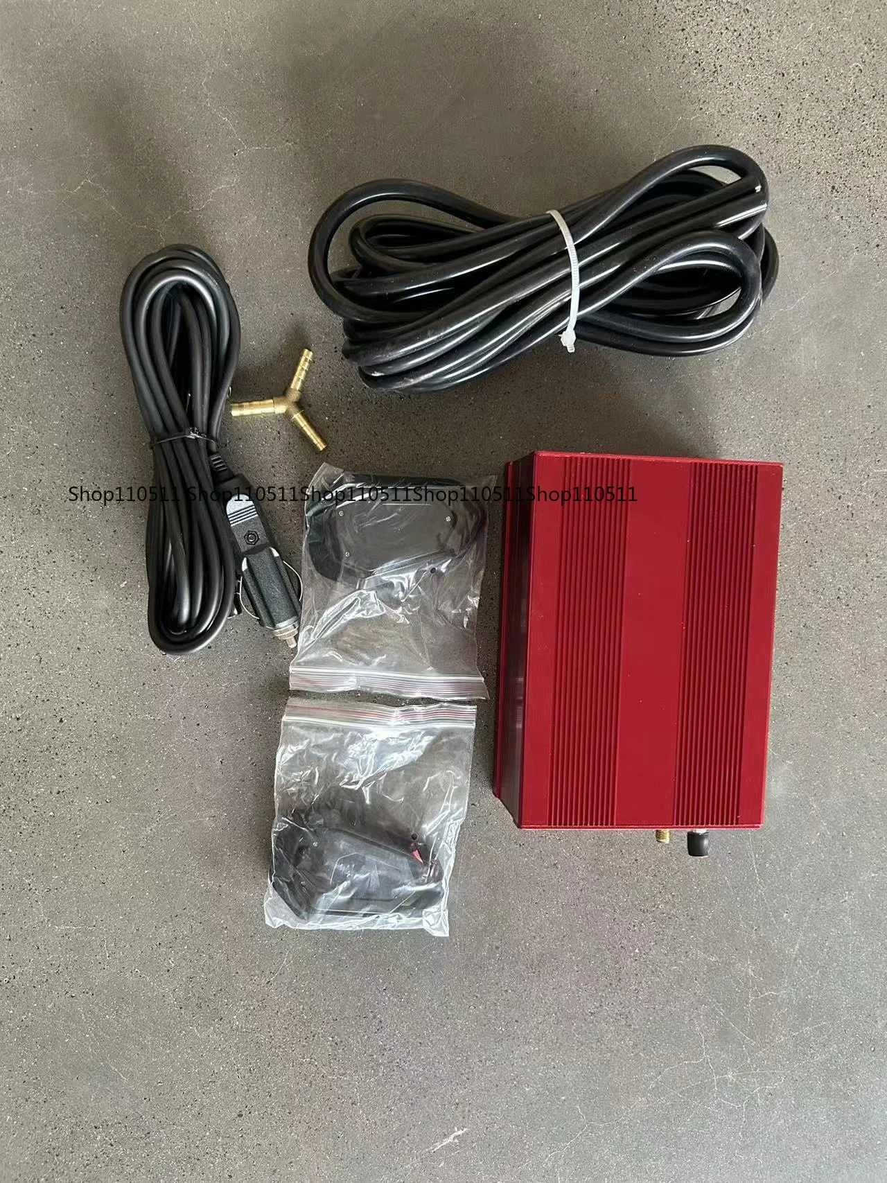 Automotive exhaust valve with built-in vacuum pump control box for remote control of exhaust valve actuators
