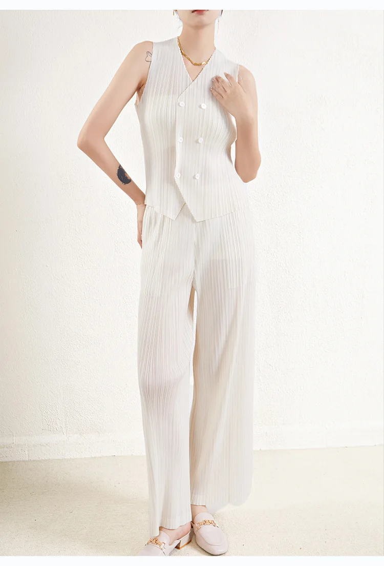 Chic and stylish professional two-piece set for spring/summer: sleeveless vest and high-waisted wide-leg trousers.