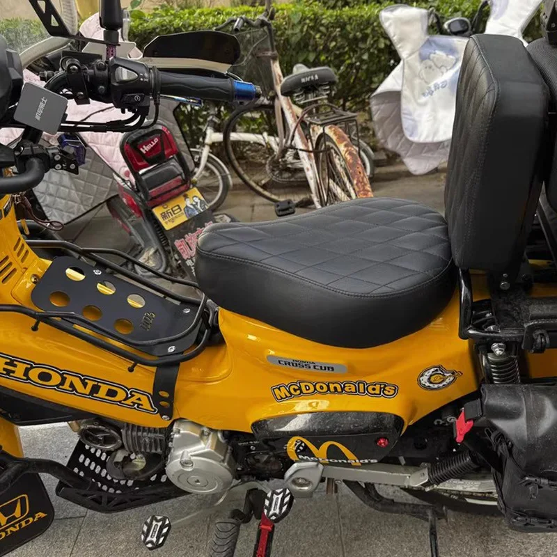 For Honda Cross Cub CC110, motorcycle modification involves lowering the seat and upgrading to a retro seat