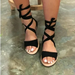 Nowe letnie sandały damskie Sexy Flock sandały na płaskim obcasie krzyż pasek bandaż Snakelike sandały oddychające Peep Toe Gladiator buty