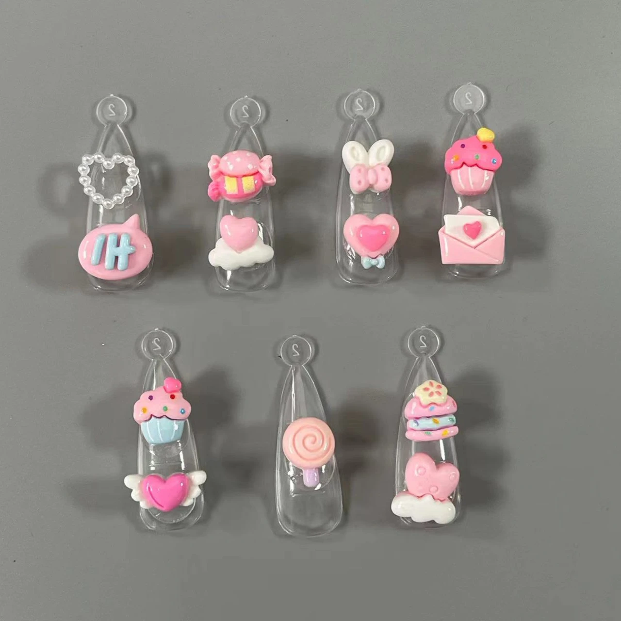 nuovo 3D Kawaii Pink Cartoon Love Lollipop Torta Ali Arco Nuvole Busta Caramelle Decorazione in resina Nail Art Charms all'ingrosso