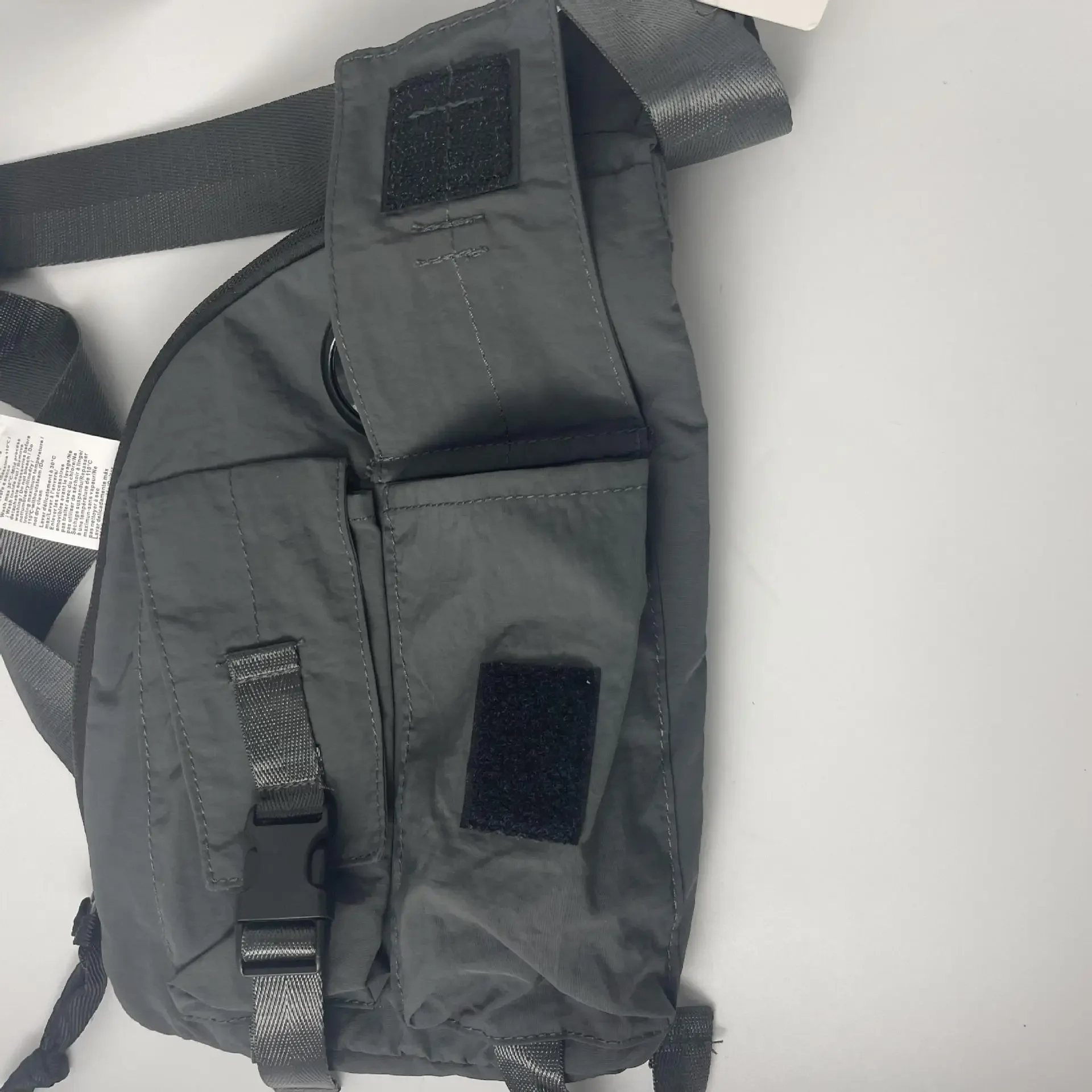 Estilo de diseñador herramientas funcionales personalizadas bolsos de pecho para hombres y mujeres CP moda ocio deportes mochila oblicua marea